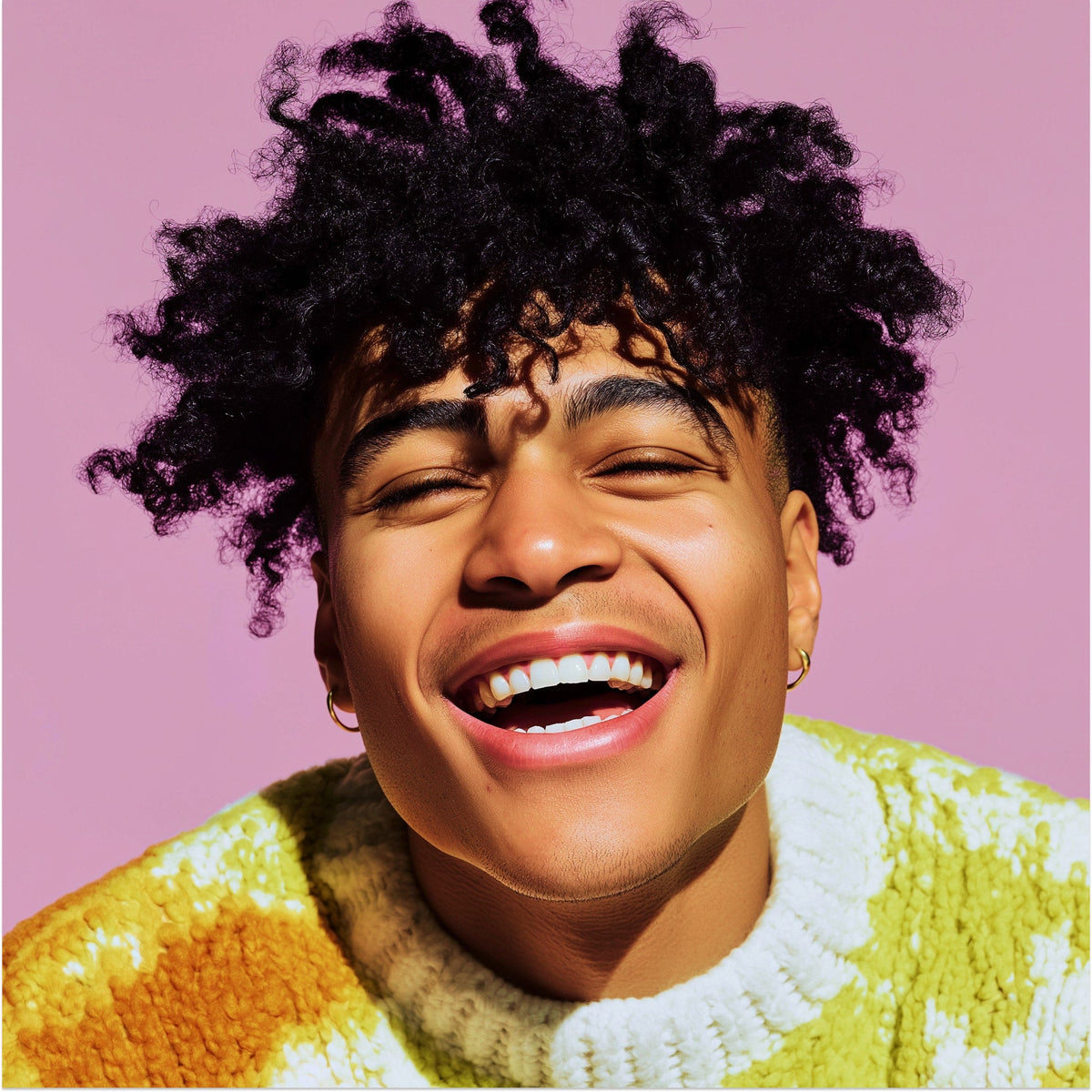 Person wearing a colorful sweater with a pink background