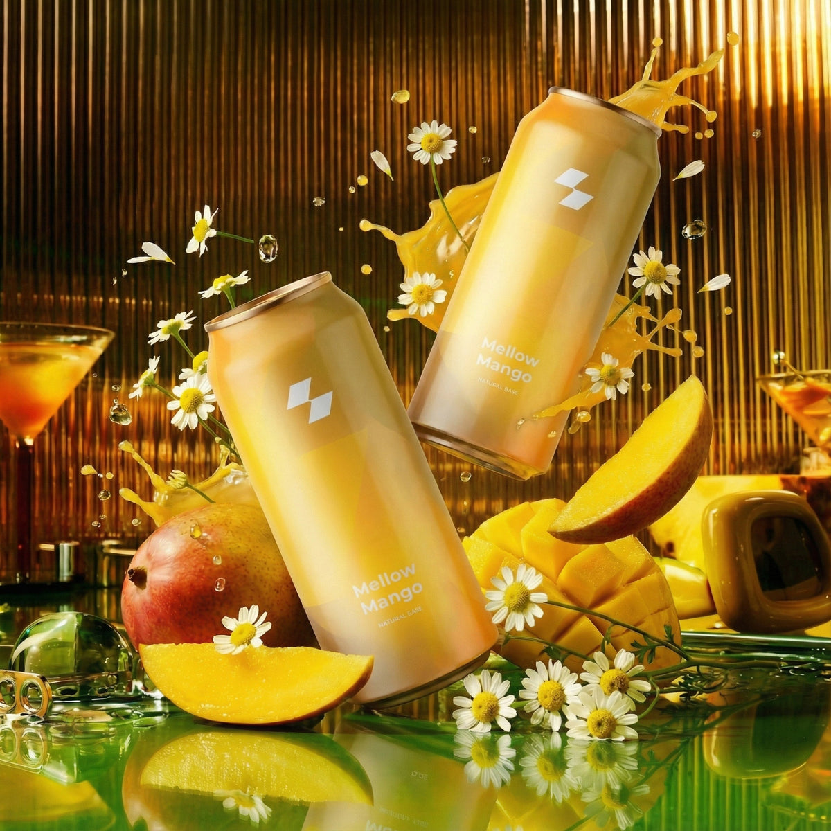 Two cans of 'Mellow Mango' with mango slices and flowers on a reflective surface.